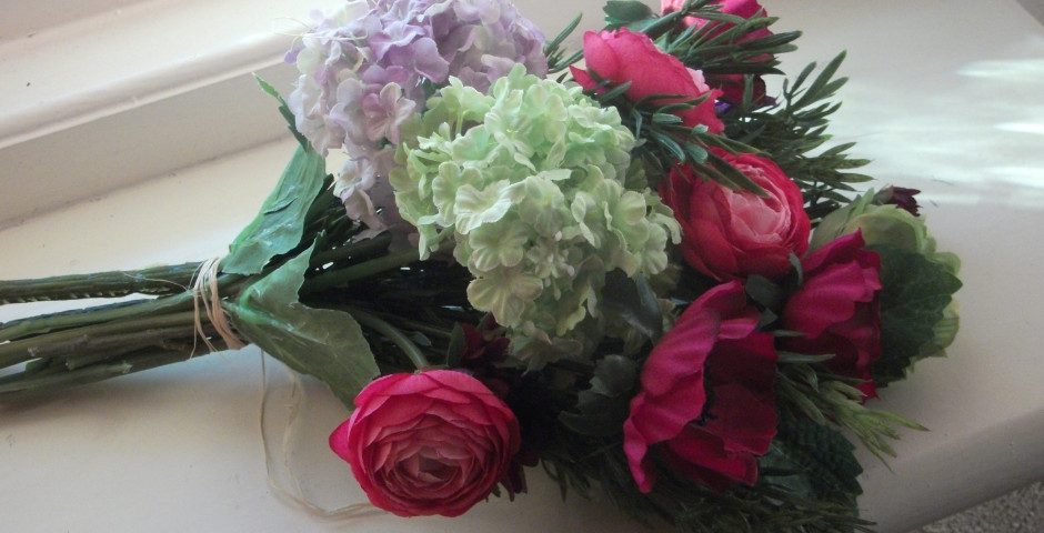 Z097 Mini traditional style handtied with pink ranunculus, anemones and green viburnum