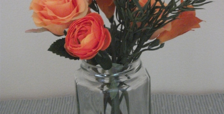 Z065 Hexagonal jar with orange freesias, rose, ranunculus and rosemary