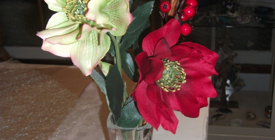 Z103 Tall  cut glass vase and red and green helibores and berries